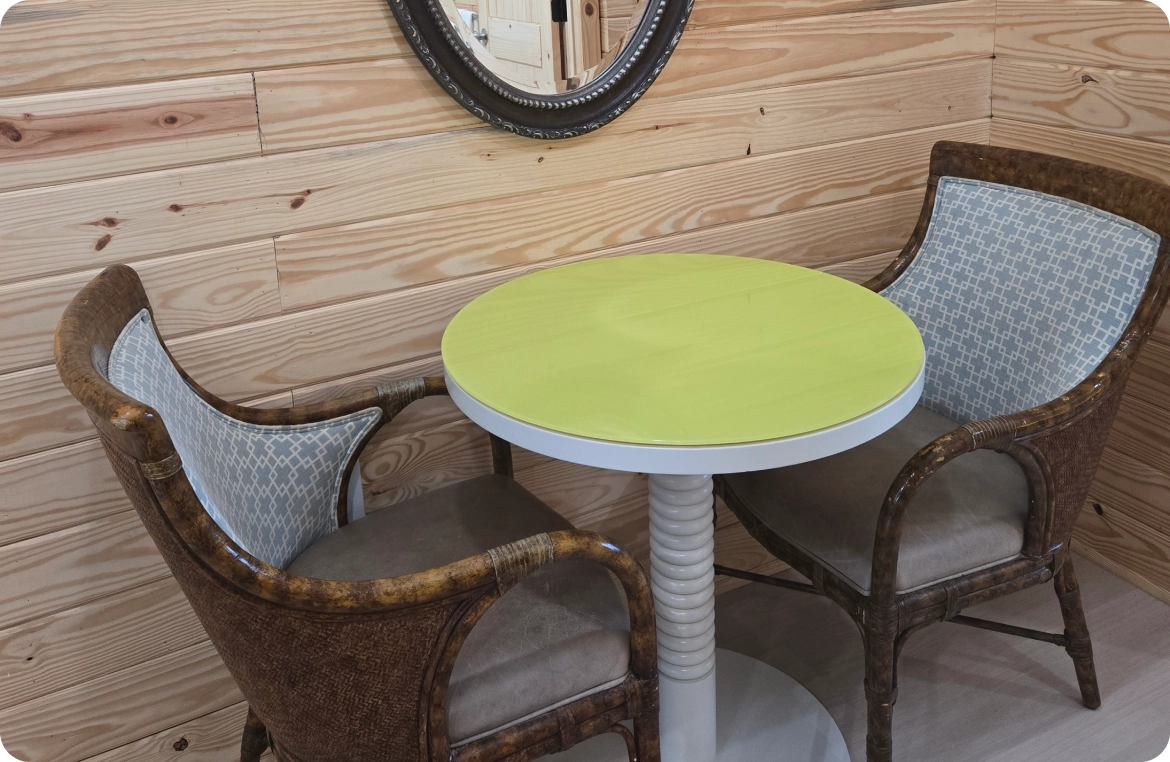 Intimate seating area with a mirror above.